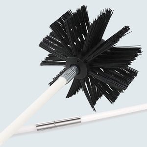 A black chimney brush head connected to a white rod, equipped with a metal connector, set against a plain backdrop.