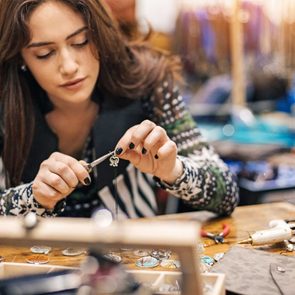 woman making jewelry