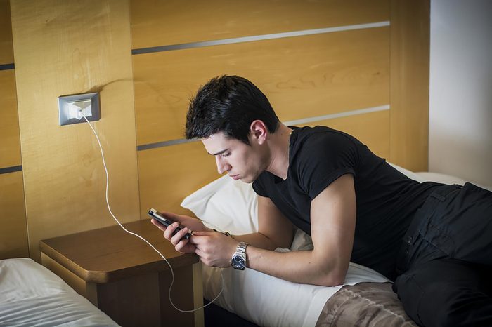 manwithphoneonbed