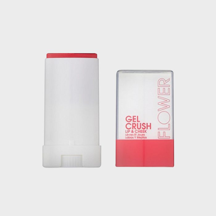 White tube displaying red product beside packaging, labeled 