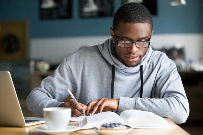 student studying with coffee