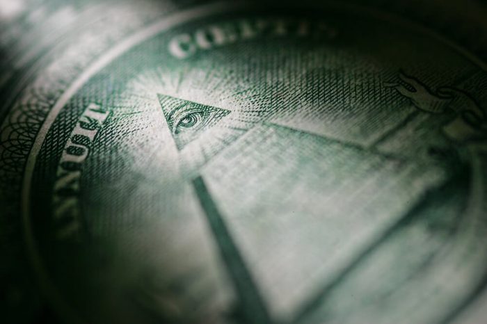 Selectively highlighted detail of the One Dollar Bill from the United States of America showing the Pyramid and the All Seeing Eye