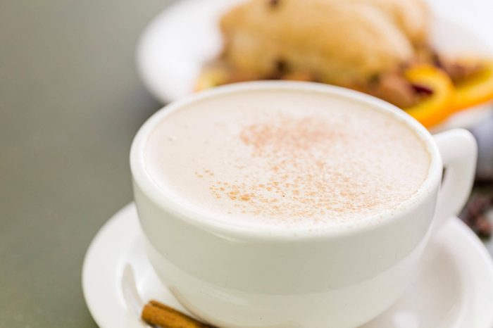 Chai tea latte withcranberry orange fresh scone for breakfast.