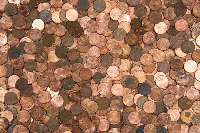 Flat view pennies. United States currency penny, many old new dirty clean viewed from directly above. The penny is the lowest denomination coin in the U.S. currency.