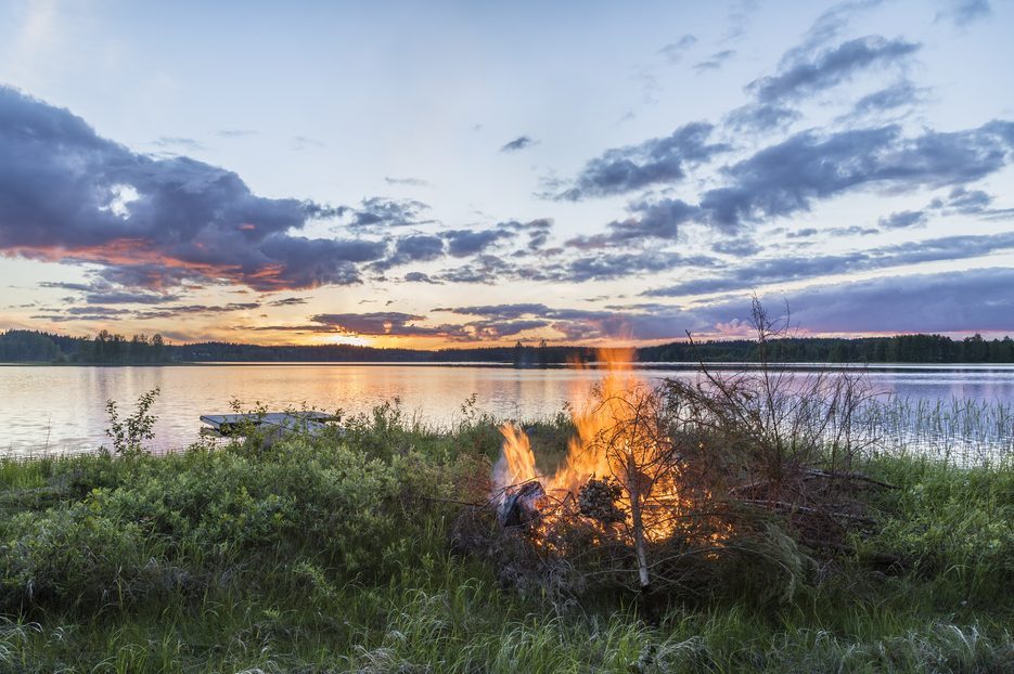 Beautiful midsummer night in Finland next to lake