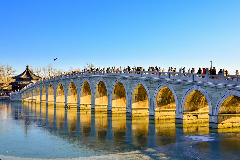 Beijing,China-January 14, 2017-golden sunshine through the hole of seventeen hole bridge in winter at the Summer Palace , Beijing China.
