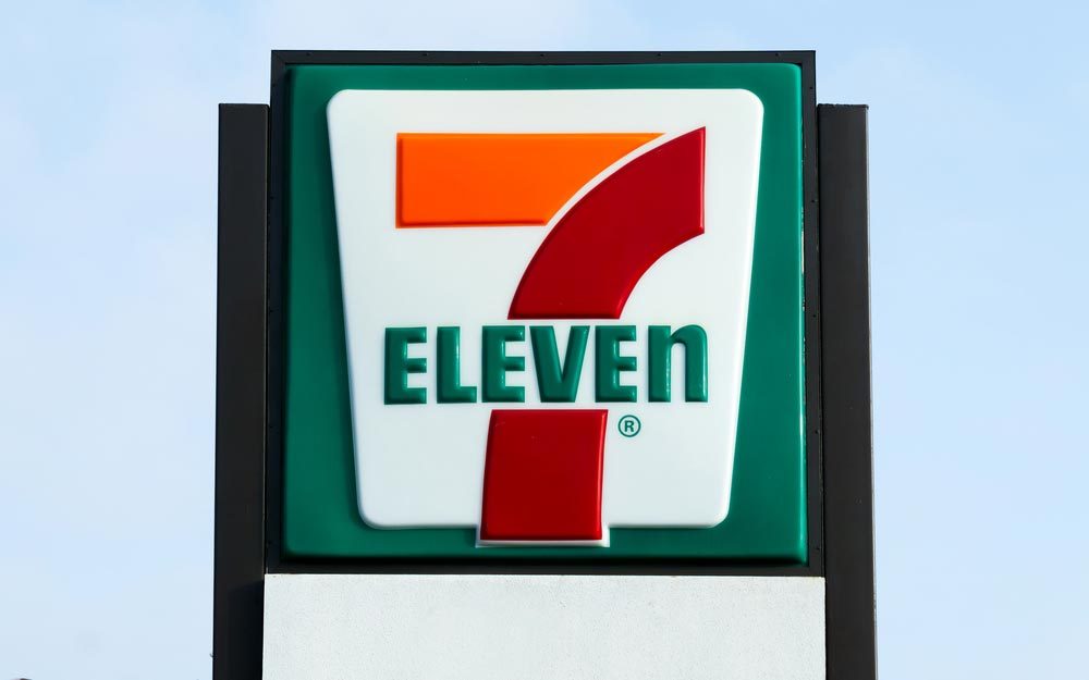 COSTA MESA, CA/USA - OCTOBER 17, 2015: 7-Eleven store exterior and sign. 7-Eleven is the world's largest operator and franchisor of convenience stores.