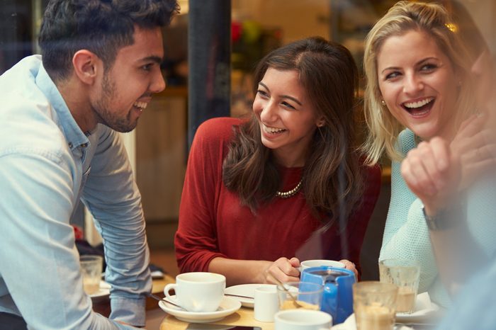 Group Of Friends In Caf�¢?? Relaxing Together
