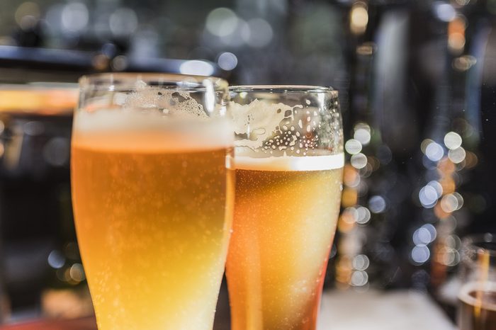 Beer glasses with beer on the bar 6