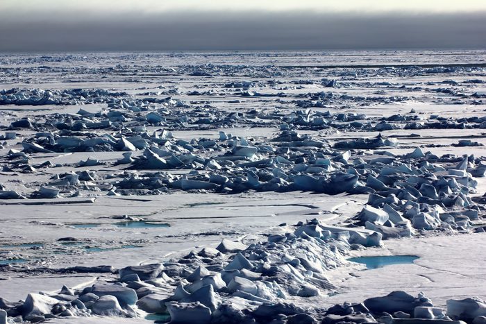 Pack ice near the North pole, hummocky polar ice. Polar day at the lowest position of the sun in late June