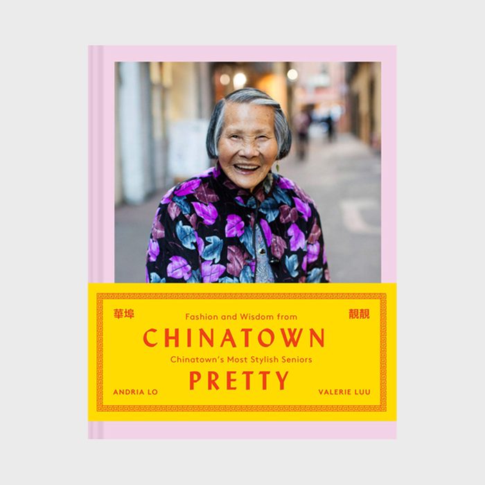 A smiling elderly woman wearing a floral jacket stands in an alley. Book cover text: 