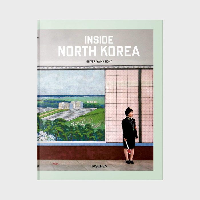 Book cover features a uniformed person standing beside a mural of a landscape, with text reading 