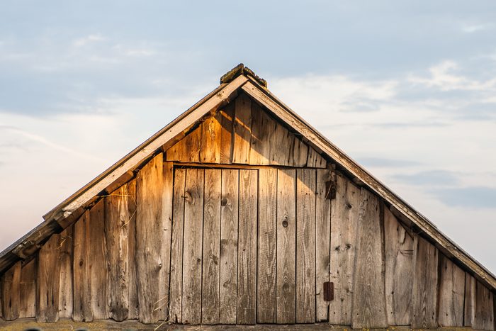 The old barn roof against the sky