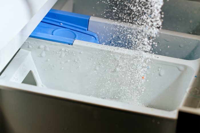 Powder is pouring into container.