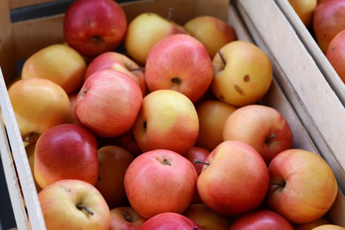 Apples on the market. Fresh organic red apples from the local farmers market. Apples background background texture seasoning Apples for sale.
