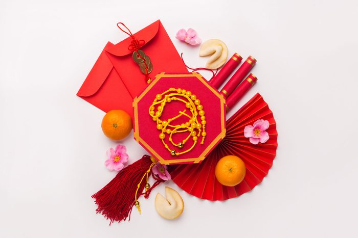 Flat Lay Chinese New Year Tangerine, Plum Blossoms And Other Traditional Accessories