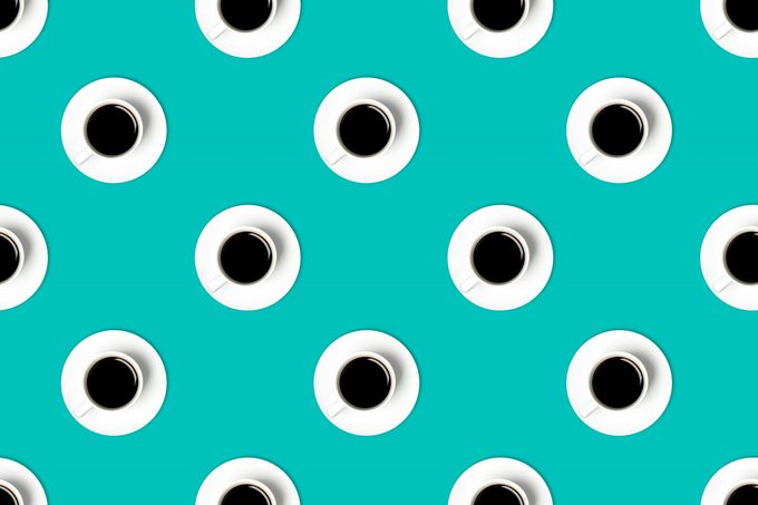 Pattern of cofee cups on greenish-blue background. 
