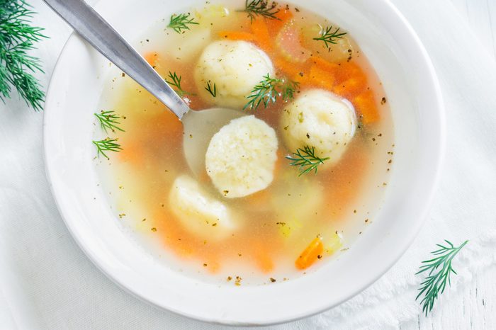 Delicious Matzoh ball soup Jewish traditional cuisine, homemade Matzo Ball soup with vegetables