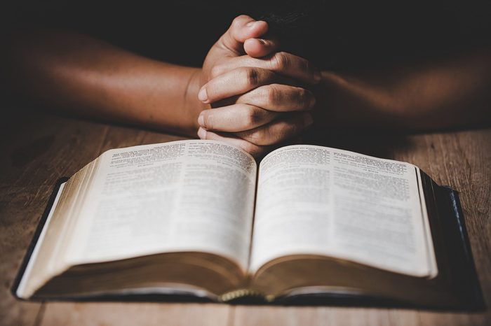 Christian life crisis prayer to god. Woman Pray for god blessing to wishing have a better life. woman hands praying to god with the bible. begging for forgiveness and believe in goodness. 