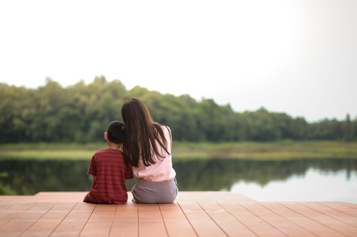 Mother and son sit back and watch the scenery.