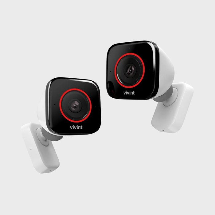 Two black and white security cameras with red circles, labeled 