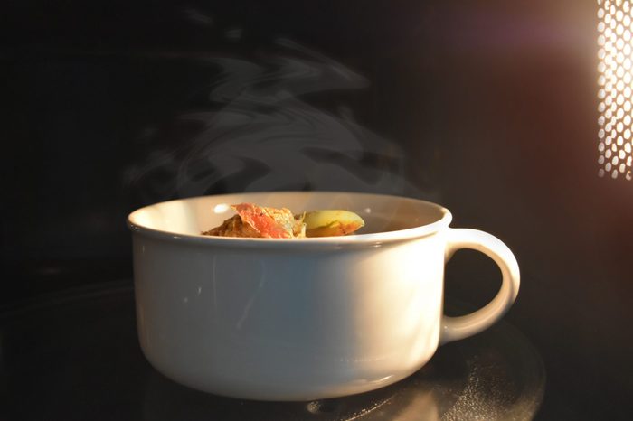 Look inside the microwave food white bowl, In a warm atmosphere and empty top space for text. - Non color ceramic is applicable