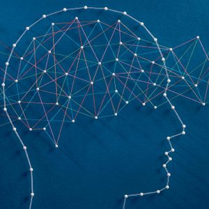 A silhouette of a head formed by interconnected strings and pins, illustrating a network on a blue background.
