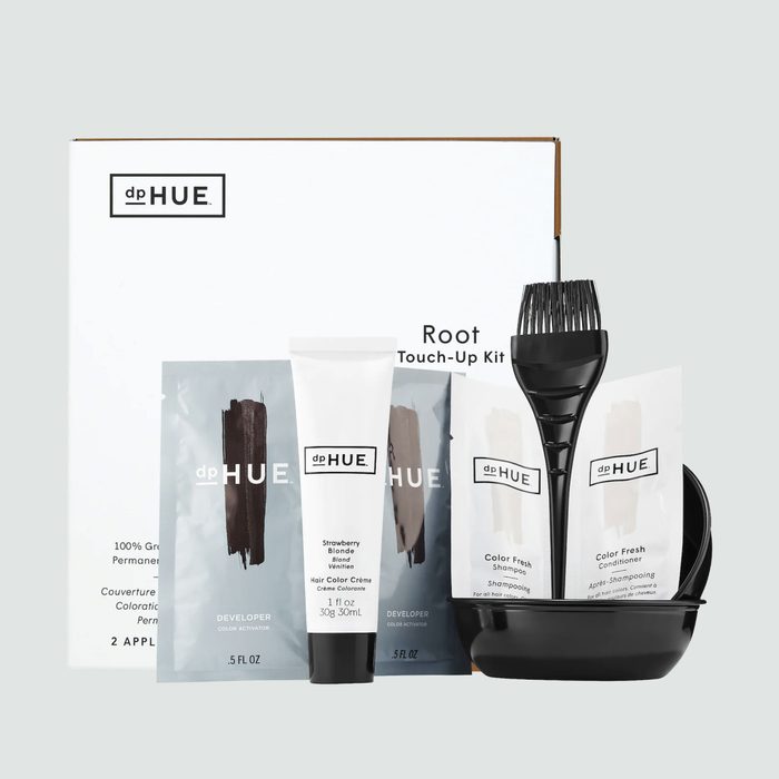 Hair color kit with brush, tubes, and packets arranged on a white box labeled 