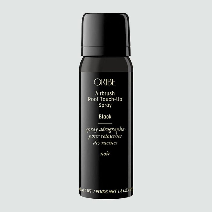 A black spray can labeled 