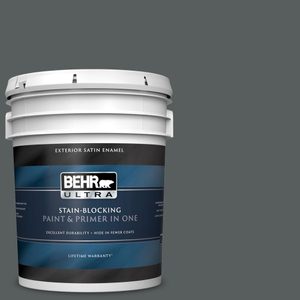 A white paint bucket displays 