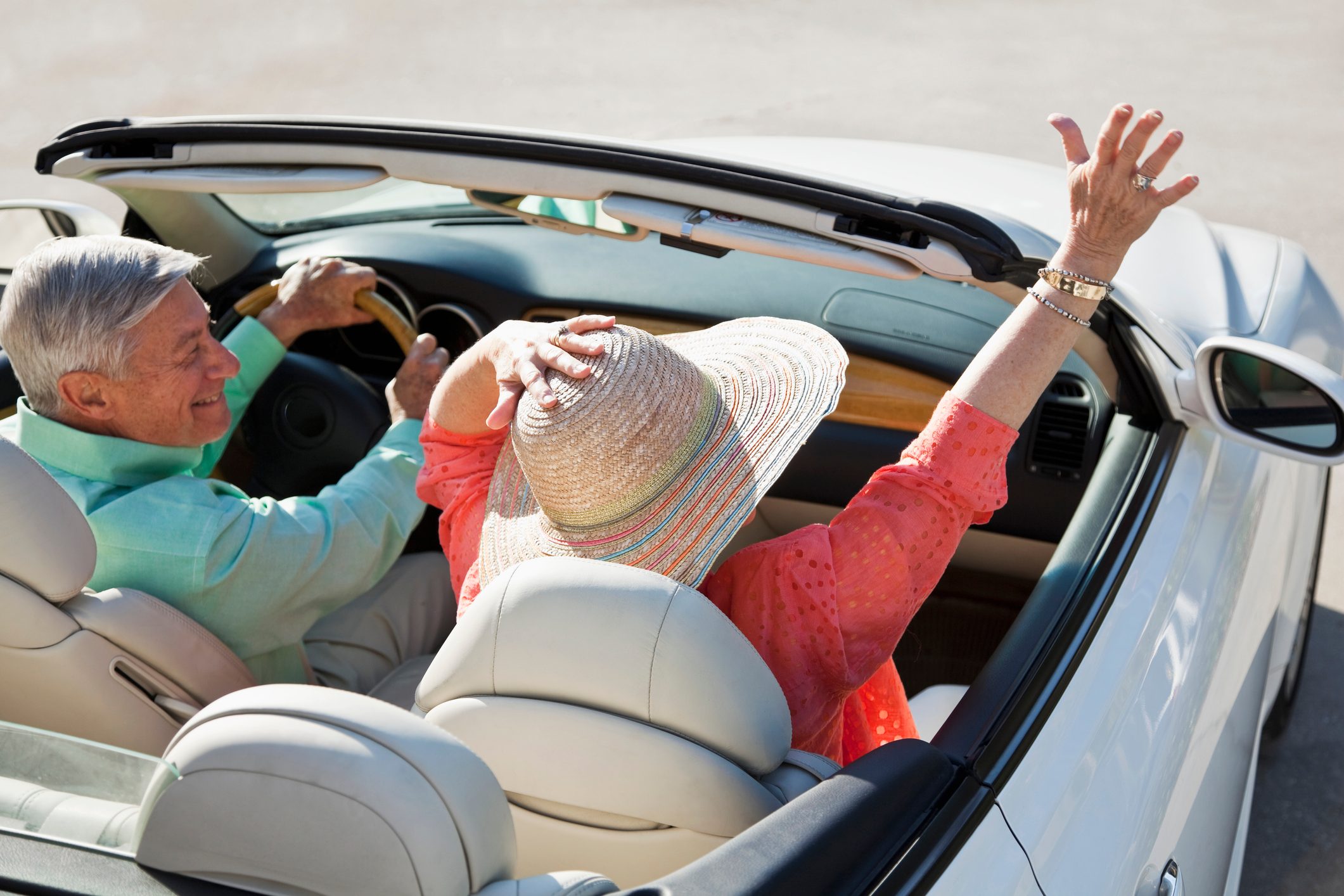 Rear view of senior couple in convertible