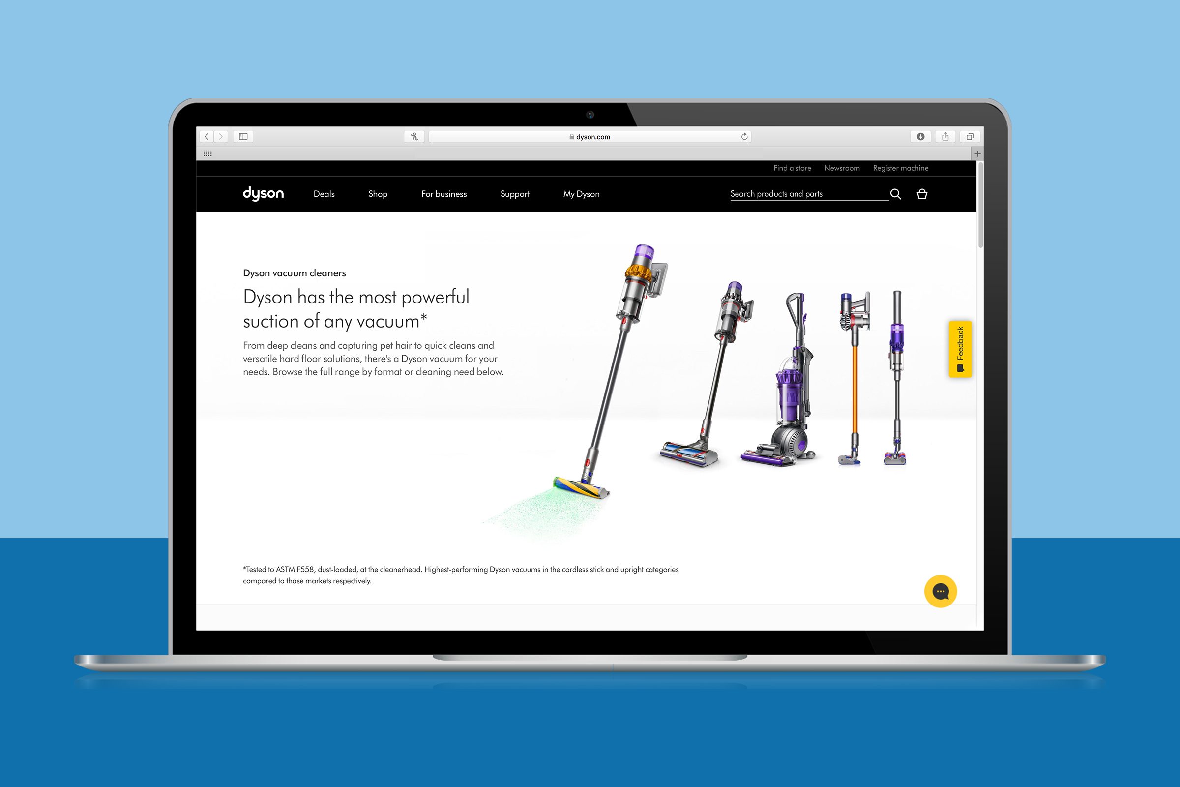 A laptop displays Dyson vacuum cleaners with promotional text about powerful suction on a blue background. Various models are illustrated beside the text.