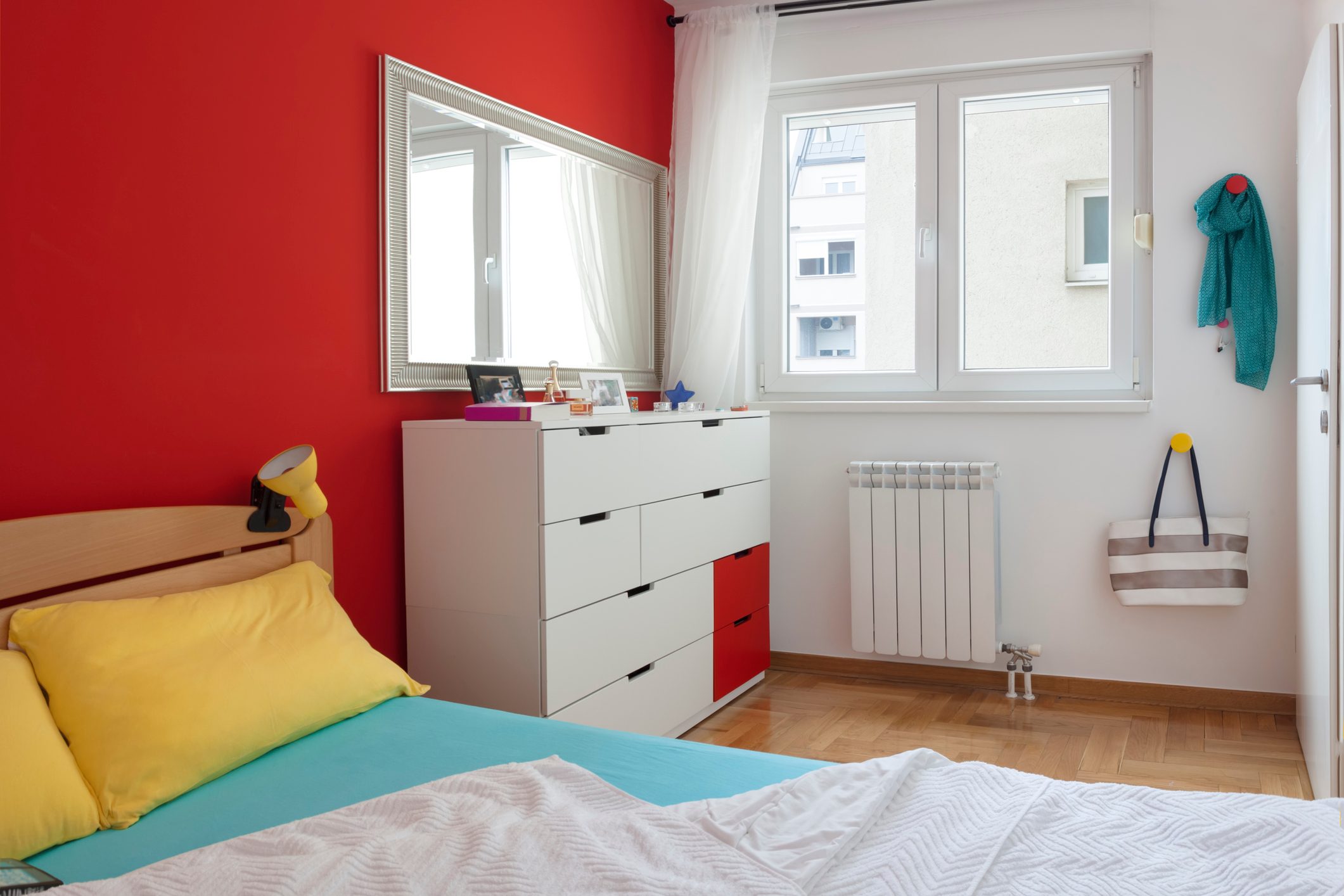 Cozy modern colorful bedroom interior with bed sheet