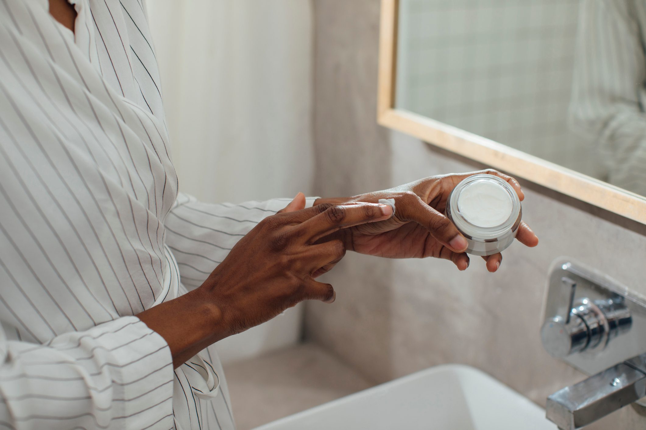 Hands of Unrecognisable Woman Holding Cosmetic Cream