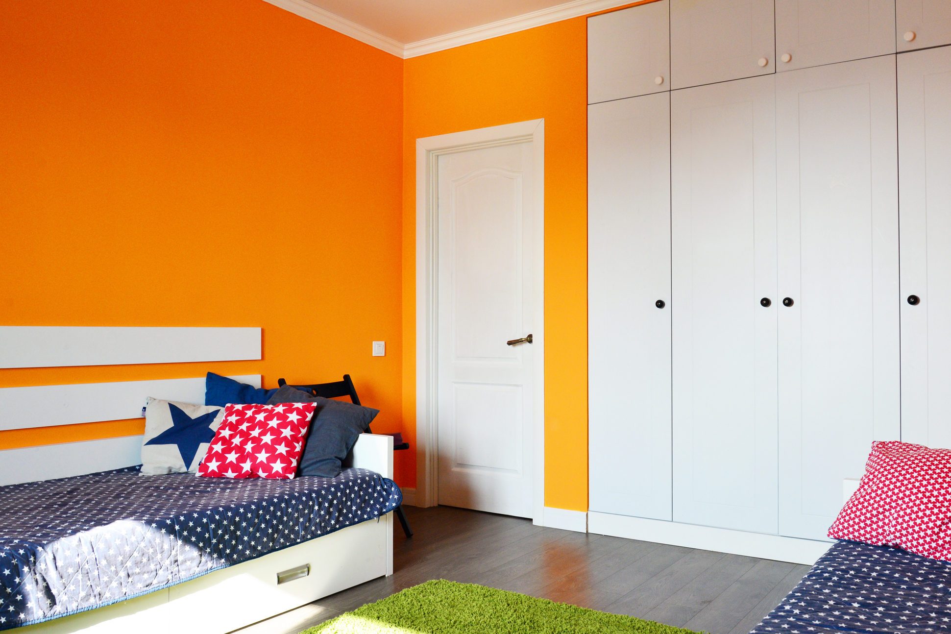 Kids bedroom in orange and blue colors