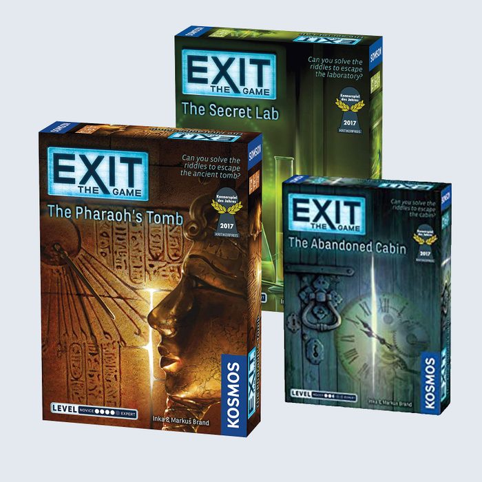 Three board game boxes titled 