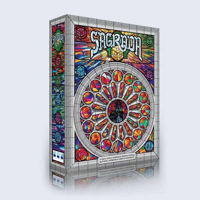 A board game box displays a vibrant stained glass design with the title 