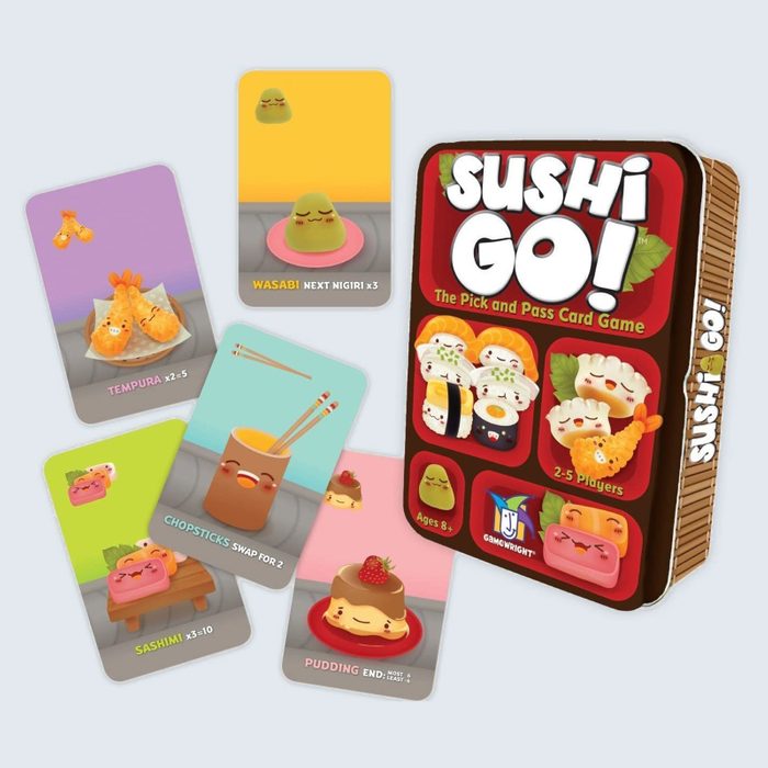 Game box and illustrated cards feature smiling sushi and Asian food, colorful text detailing card actions. Context suggests a playful card game environment.