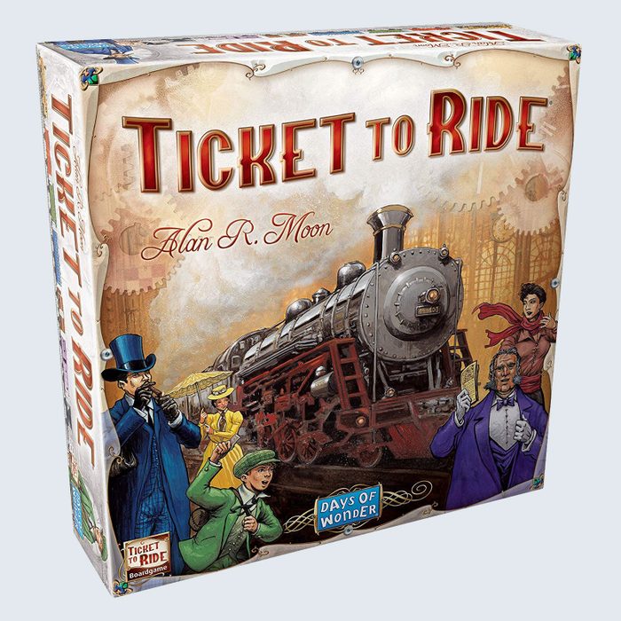 Board game box shows diverse characters around a steam locomotive. Text reads 