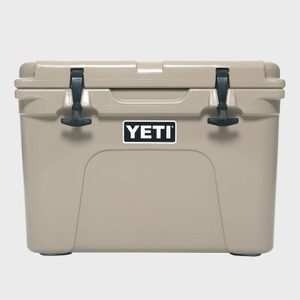 Tan cooler with a square shape, featuring black latches. The brand 