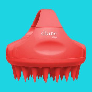 Red scalp massager with pointed bristles, labeled 