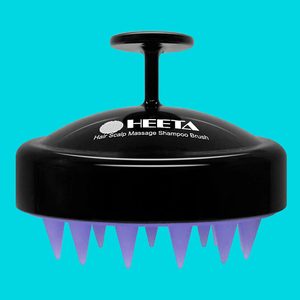 Brush with ergonomic handle massages scalp, featuring soft purple bristles; labeled 