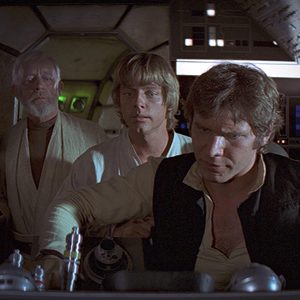 Three individuals concentrating, standing at a starship's control panel, inside a futuristic and dimly lit cockpit.