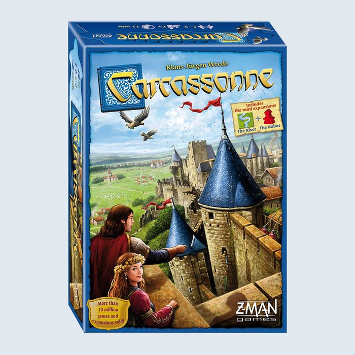 Board game box depicting a medieval castle; figures admire the view within a countryside setting. Text includes 