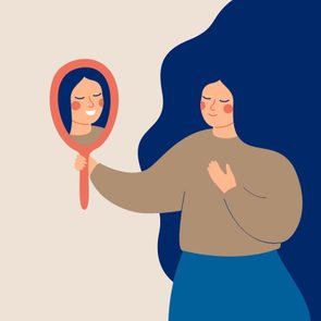 A person holds a mirror, smiling at their reflection, with a serene expression in a minimalist setting, wearing simple casual clothing.