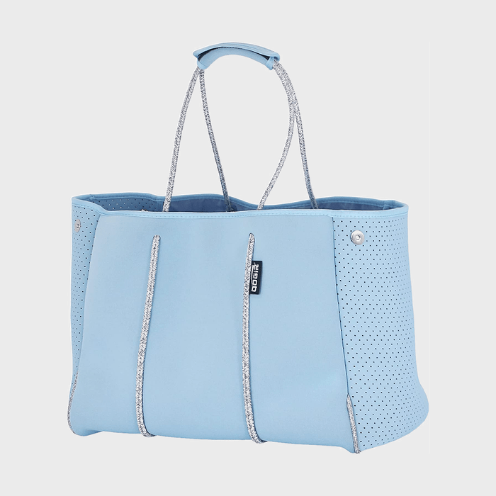 Blue tote bag with perforated sides, featuring silver handles and trim, displayed against a plain white background.