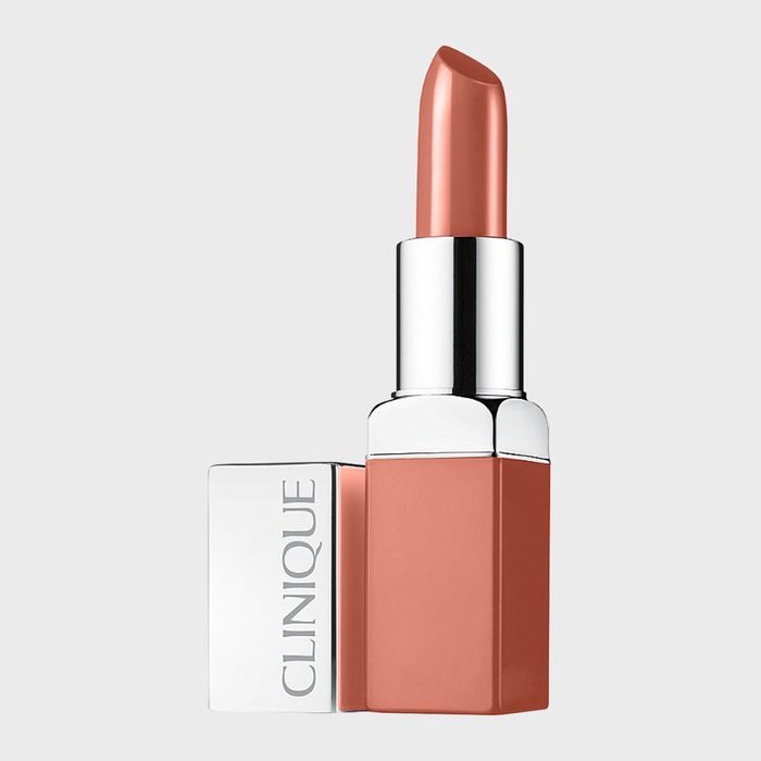 Lipstick is upright and opened, showing a warm nude shade, with 