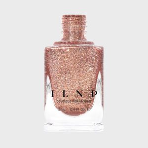 A sparkling pink nail polish bottle stands upright against a plain background. Text reads 