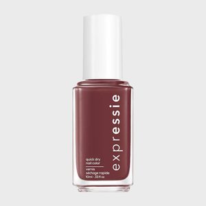 A nail polish bottle stands upright, labeled 