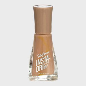 A nail polish bottle stands upright with beige color, labeled 